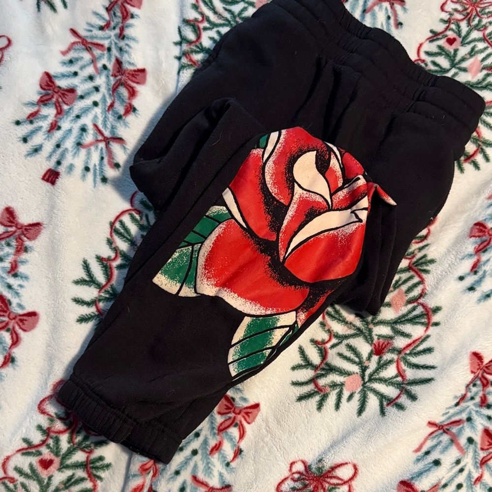 No Boundaries Black Sweatpants with Red and Green Rose Design
